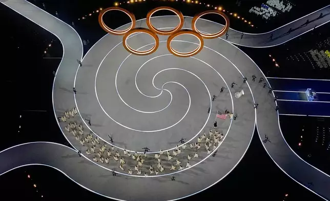 Team United States enters the stadium during the Olympic opening ceremony at the 2026 Winter Olympics, in Milan, Italy, Friday, Feb. 6, 2026. (AP Photo/David J. Phillip)