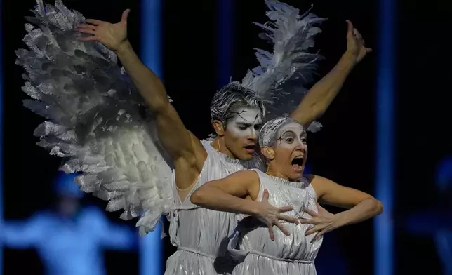 Dancers performs during the Olympic opening ceremony at the 2026 Winter Olympics, in Milan, Italy, Friday, Feb. 6, 2026 (AP Photo/Natacha Pisarenko)