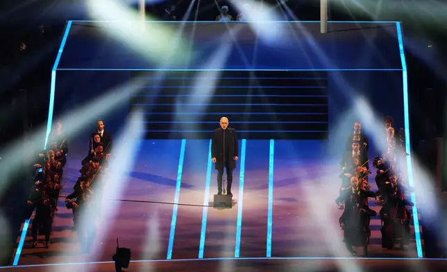 Singer Andrea Bocelli performs during the Olympic opening ceremony at the 2026 Winter Olympics, in Milan, Italy, Friday, Feb. 6, 2026. (AP Photo/Stephanie Scarbrough)