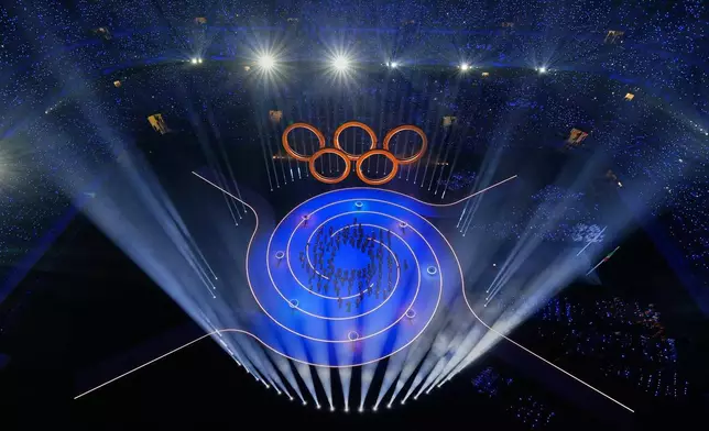 Entertainers perform during the Olympic opening ceremony at the 2026 Winter Olympics, in Milan, Italy, Friday, Feb. 6, 2026. (AP Photo/David J. Phillip)
