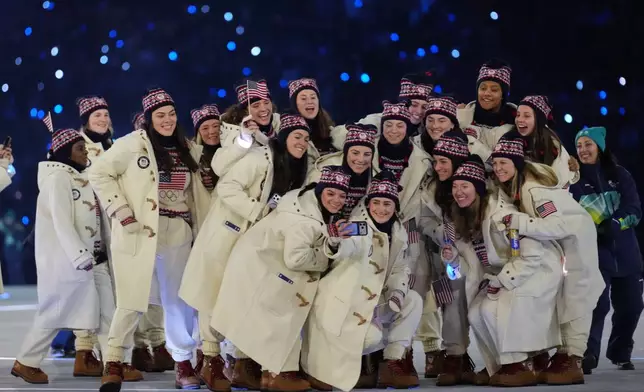 Team USA takes a group photo during the Olympic opening ceremony at the 2026 Winter Olympics, in Milan, Italy, Friday, Feb. 6, 2026. (AP Photo/Natacha Pisarenko)
