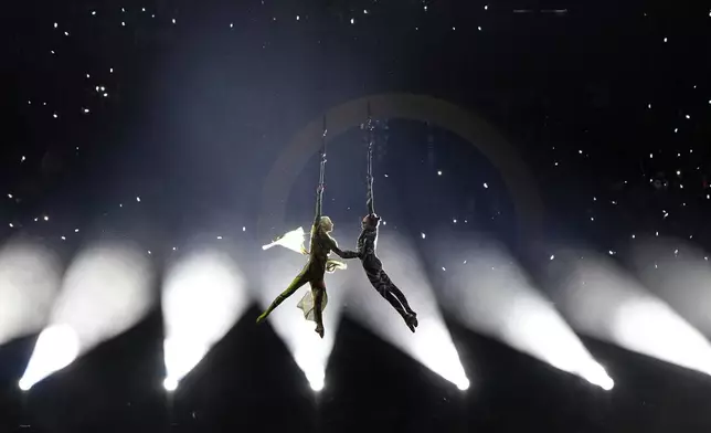 Dancers perform during the Olympic opening ceremony at the 2026 Winter Olympics, in Milan, Italy, Friday, Feb. 6, 2026. (AP Photo/Francisco Seco)