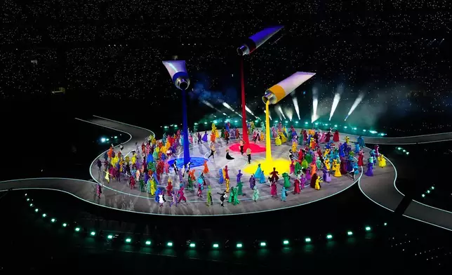 Artists perform during the Olympic opening ceremony at the 2026 Winter Olympics, in Milan, Italy, Friday, Feb. 6, 2026. (AP Photo/Petr David Josek)