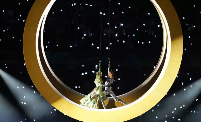 Artists perform during the Olympic opening ceremony at the 2026 Winter Olympics, in Milan, Italy, Friday, Feb. 6, 2026. (AP Photo/Stephanie Scarbrough)