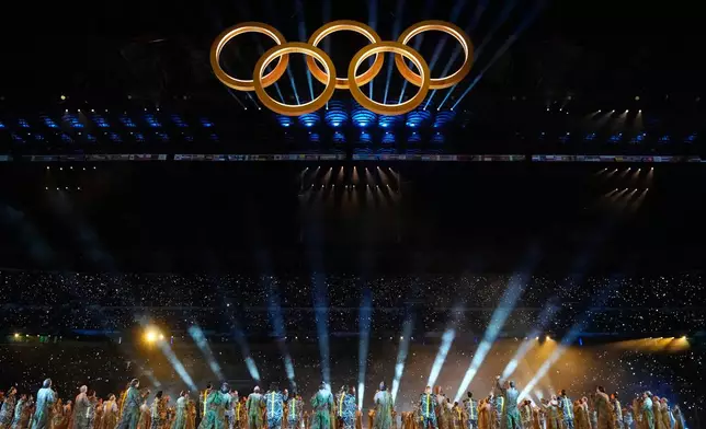 The Olympic rings are formed during a performance at the Olympic opening ceremony at the 2026 Winter Olympics, in Milan, Italy, Friday, Feb. 6, 2026. (AP Photo/Natacha Pisarenko)