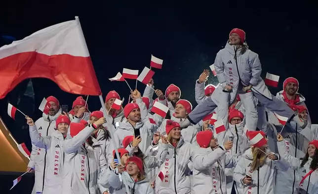 Poland athletes walk during the Olympic opening ceremony at the 2026 Winter Olympics, in Milan, Italy, Friday, Feb. 6, 2026. (AP Photo/Lee Jin-man)