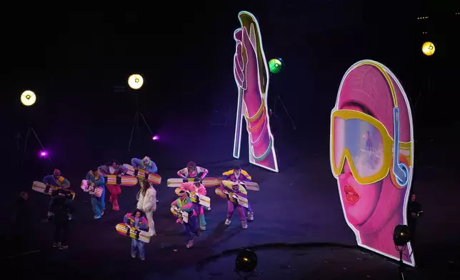 Artists perform during the Olympic opening ceremony at the 2026 Winter Olympics, in Milan, Italy, Friday, Feb. 6, 2026. (AP Photo/Ben Curtis)