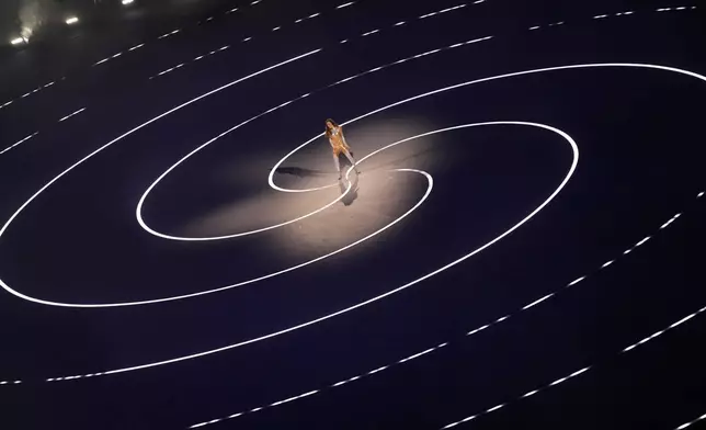 Italian actor Sabrina Impacciatore performs during the Olympic opening ceremony at the 2026 Winter Olympics, in Milan, Italy, Friday, Feb. 6, 2026. (AP Photo/Francisco Seco)