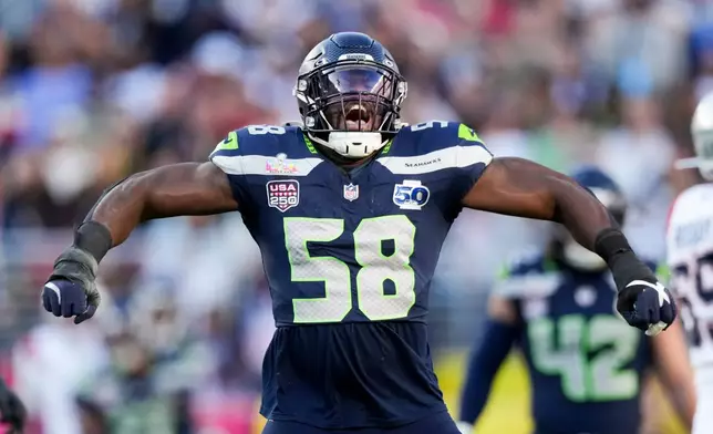 Seattle Seahawks linebacker Derick Hall (58) celebrates after sacking New England Patriots quarterback Drake Maye during the first half of the NFL Super Bowl 60 football game, Sunday, Feb. 8, 2026, in Santa Clara, Calif. (AP Photo/Morry Gash)