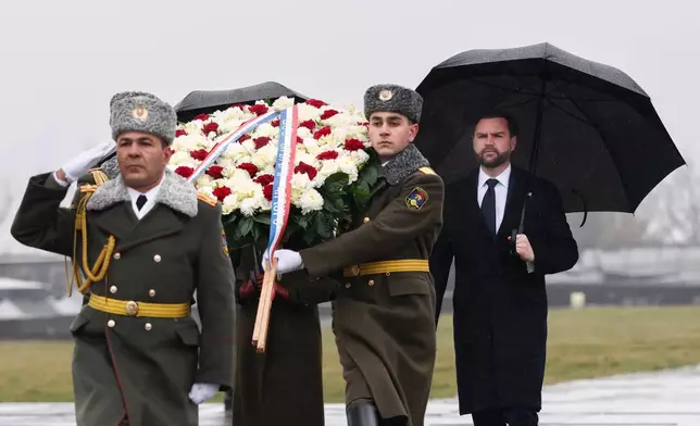 U.S. Vice President JD Vance takes part in the wreath-laying ceremony during a visit to the Tsitsernakaberd Armenian Genocide Memorial in Yerevan, Armenia Tuesday, Feb. 10, 2026. (Kevin Lamarque/Pool Photo via AP)