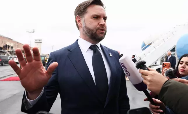 U.S. Vice President J.D. Vance speaks to the media before boarding Air Force Two upon departure for Azerbaijan, at Zvartnots International Airport in Yerevan, Armenia, Tuesday Feb. 10, 2026. (Kevin Lamarque/Pool Photo via AP)