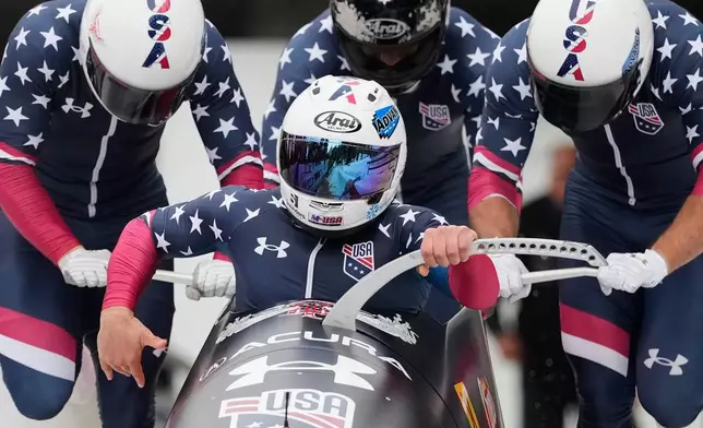 FILE -Frank del Duca, Joshua Williamson, Boone Niederhofer and Bryce Cheek, of the United States, compete in the 4-man bobsleigh race at the Bobsleigh World Cup in Innsbruck, Austria, Nov. 30, 2025. (AP Photo/Matthias Schrader, File)