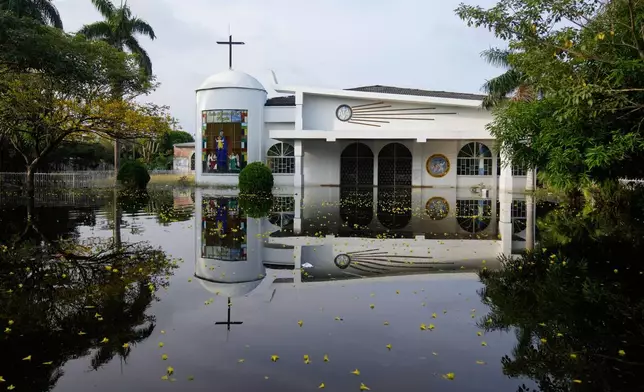 The Maria de los Angeles Church is flooded after the Sinu River overflowed in Monteria, Colombia, Tuesday, Feb. 10, 2026. (AP Photo/Fernando Vergara)