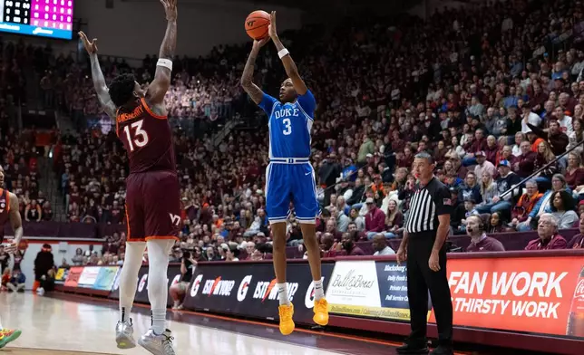 Duke guard Isaiah Evans (3) shoots over Virginia Tech forward Amani Hansberry (13) during the first half of an NCAA college basketball game, Saturday, Jan. 31, 2026, in Blacksburg, Va. (AP Photo/Robert Simmons)
