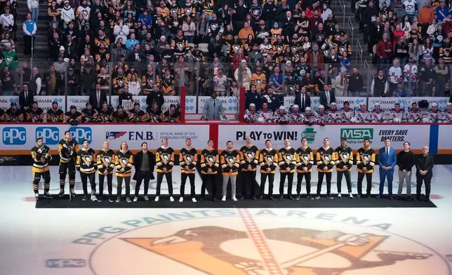 Members of the 2016 Stanley Cup Champion Pittsburgh Penguins are honored before an NHL hockey game against the New York Rangers in Pittsburgh, Saturday, Jan. 31, 2026. (AP Photo/Gene J. Puskar)