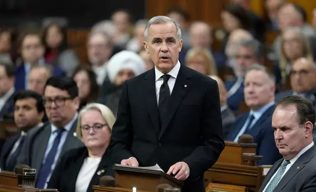 Prime Minister Mark Carney rises in the House of Commons Wednesday, Feb.11, 2026. (Adrian Wyld/The Canadian Press via AP)