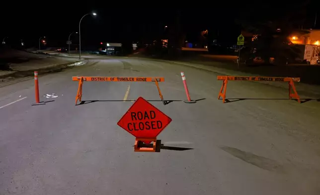 The road is blocked off before the Tumbler Ridge Secondary School, in Tumbler Ridge, B.C., Canada, on Wednesday, Feb. 11, 2026. (Jesse Boily/The Canadian Press via AP)