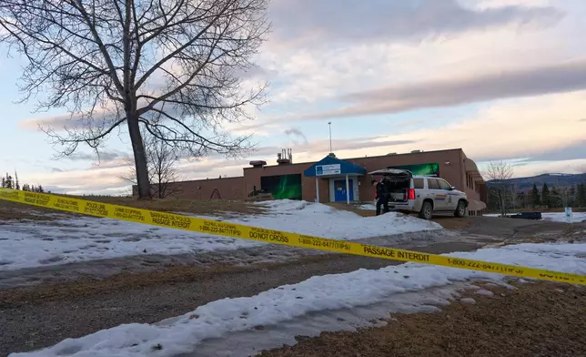 Police began putting tape out near the Tumbler Ridge Secondary School and surrounding buildings in Tumbler Ridge, B.C. on Wednesday, Feb. 11, 2026.(Jesse Boily /The Canadian Press via AP)