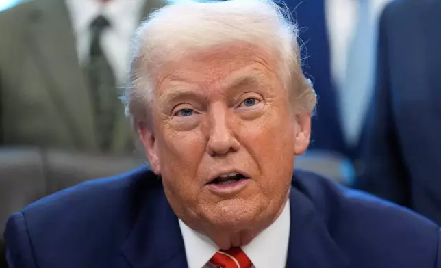President Donald Trump speaks to reporters after signing a spending bill that ends a partial shutdown of the federal government in the Oval Office of the White House, Tuesday, Feb. 3, 2026, in Washington. (AP Photo/Alex Brandon)