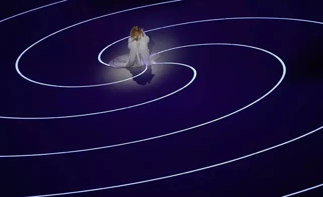 Singer Mariah Carey performs during the Olympic opening ceremony at the 2026 Winter Olympics, in Milan, Italy, Friday, Feb. 6, 2026. (AP Photo/Francisco Seco)