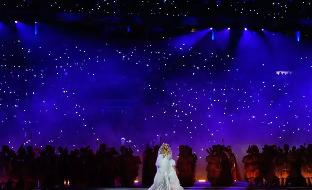Singer Mariah Carey performs during the Olympic opening ceremony at the 2026 Winter Olympics, in Milan, Italy, Friday, Feb. 6, 2026. (AP Photo/Ashley Landis)