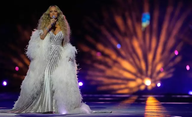 Singer Mariah Carey performs during the Olympic opening ceremony at the 2026 Winter Olympics, in Milan, Italy, Friday, Feb. 6, 2026. (AP Photo/Natacha Pisarenko)