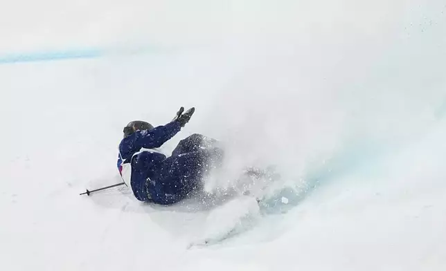 Britain's Kirsty Muir crashes during the women's freestyle skiing big air finals at the 2026 Winter Olympics, in Livigno, Italy, Monday, Feb. 16, 2026. (AP Photo/Gregory Bull)