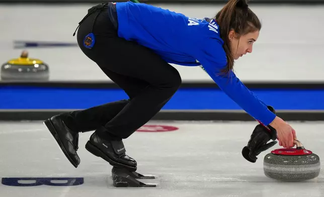 Italy's Stefania Constantini in action during the mixed doubles round robin phase of the curling competition against Estonia, at the 2026 Winter Olympics, in Cortina d'Ampezzo, Italy, Friday, Feb. 6, 2026. (AP Photo/Misper Apawu)