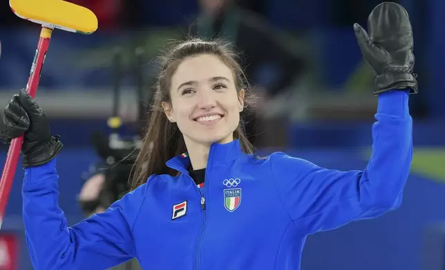 Italy's Stefania Constantini celebrates their win during the mixed doubles round robin phase of the curling competition against Estonia, at the 2026 Winter Olympics, in Cortina d'Ampezzo, Italy, Friday, Feb. 6, 2026. (AP Photo/Misper Apawu)
