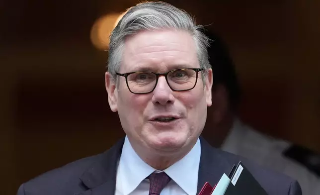 Britain's Prime Minister Keir Starmer departs 10 Downing Street to go to the House of Commons for his weekly Prime Minister's Questions in London, Wednesday, Feb. 4, 2026. (AP Photo/Alastair Grant)