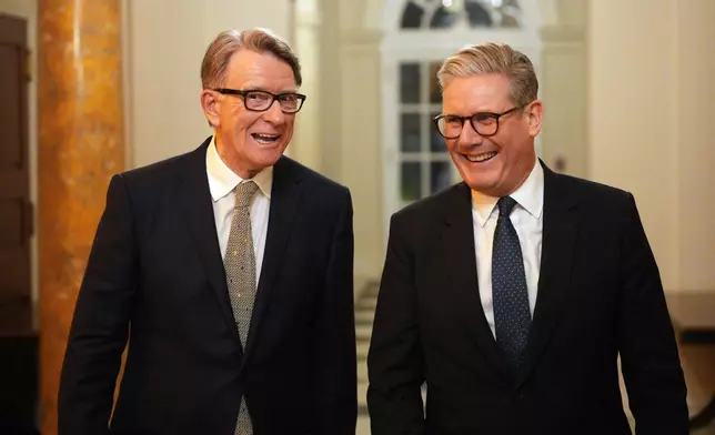 FILE - British Prime Minister Keir Starmer, right, talks with Britain's ambassador to the United States Peter Mandelson during a welcome reception at the ambassador's residence on Wednesday, Feb. 26, 2025 in Washington. (Carl Court/Pool Photo via AP, file)