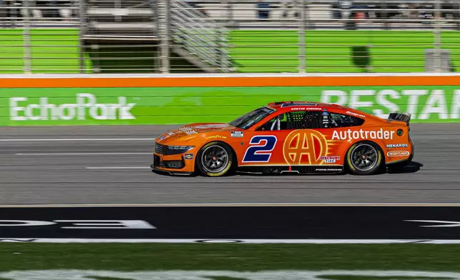Austin Cindric drives on the track before winning the first stage during a NASCAR Cup Series auto race, Sunday, Feb. 22, 2026, in Hampton, Ga. (AP Photo/Colin Hubbard)