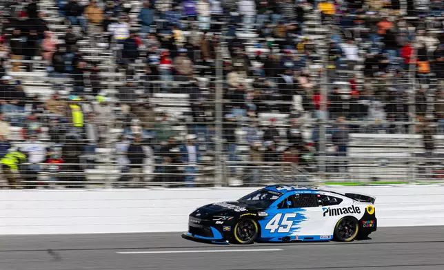 Tyler Reddick drives on the track during a NASCAR Cup Series auto race, Sunday, Feb. 22, 2026, in Hampton, Ga. (AP Photo/Colin Hubbard)