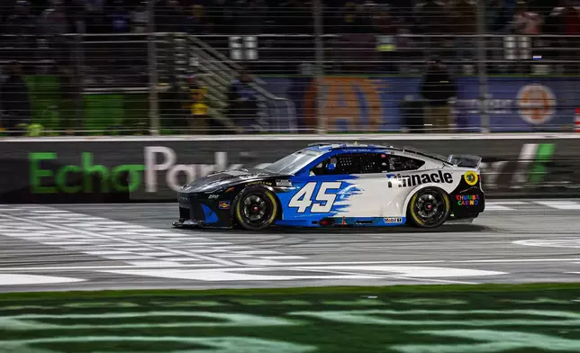 Tyler Reddick wins a NASCAR Cup Series auto race, Sunday, Feb. 22, 2026, in Hampton, Ga. (AP Photo/Colin Hubbard)