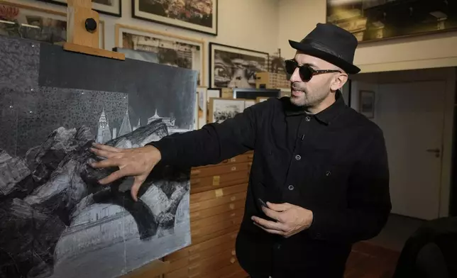 French artist JR shows his project Pont Neuf Cavern during an interview with The Associated Press in his studio, in Paris, France, Tuesday, Feb. 17, 2026. (AP Photo/Thibault Camus)