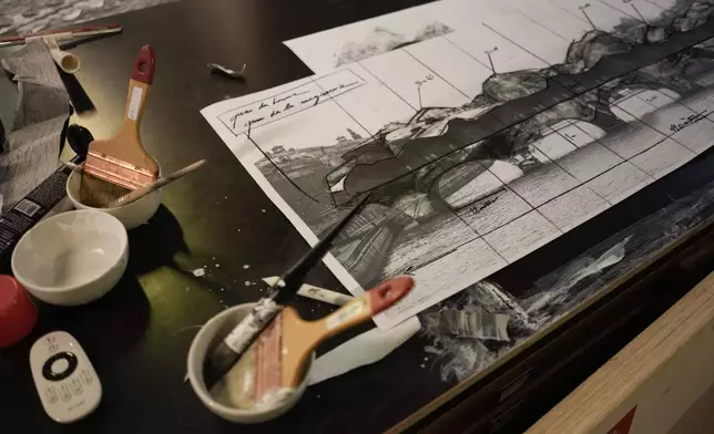 A photomontage shows the project by French artist JR called Pont Neuf Cavern in his studio, in Paris, France, Tuesday, Feb. 17, 2026. (AP Photo/Thibault Camus)