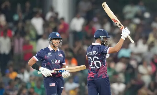 United States' Shubham Ranjane, right, celebrates his fifty runs during the T20 World Cup cricket match between Pakistan and the United States in Colombo, Sri Lanka, Tuesday, Feb. 10, 2026. (AP Photo/Eranga Jayawardena)