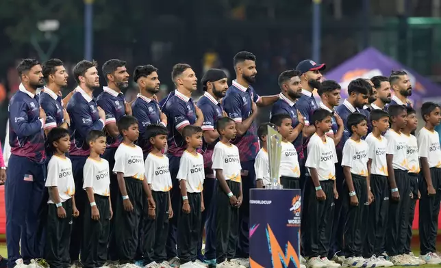 United States players stand for national anthem before the start of the T20 World Cup cricket match between Pakistan and the United States in Colombo, Sri Lanka, Tuesday, Feb. 10, 2026. (AP Photo/Eranga Jayawardena)