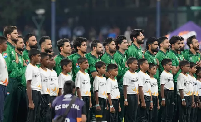 Pakistan's players stand for national anthem before the start of the the T20 World Cup cricket match between Pakistan and the United States in Colombo, Sri Lanka, Tuesday, Feb. 10, 2026. (AP Photo/Eranga Jayawardena)