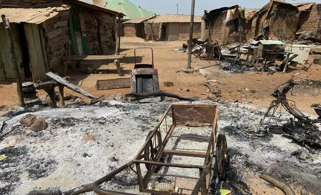 Charred homes and tools are in ruins days after an attack in the village of Woro, Nigeria, Thursday, Feb. 5, 2026. (AP Photo/Musa Salim)