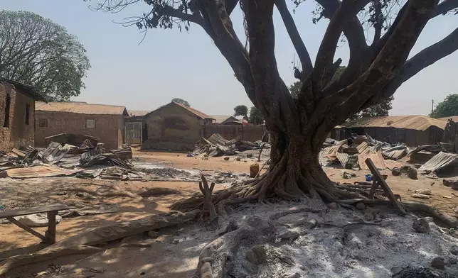 Ashes cover the ground days after an attack on the village of Woro, Nigeria, Thursday, Feb. 5, 2026. (AP Photo/Musa Salim)