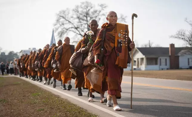 FILE - Bhikkhu Pannakara leads other buddhist monks while they participate in the, "Walk For Peace," in Saluda, S.C., Jan. 8, 2026. (AP Photo/Allison Joyce, File)