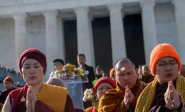 Buddhist monks reach the Lincoln Memorial, during their Walk for Peace, in Washington, Wednesday, Feb., 11, 2026. (AP Photo/Rod Lamkey, Jr.)