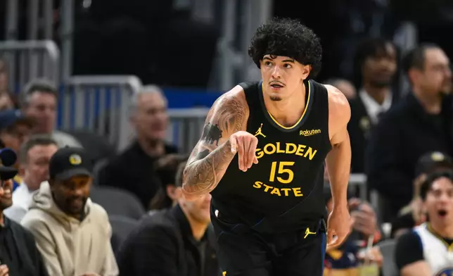 Golden State Warriors forward Gui Santos celebrates a 3-point basket against the Philadelphia 76ers during the first half of an NBA basketball game, Tuesday, Feb. 3, 2026, in San Francisco. (AP Photo/Eakin Howard)