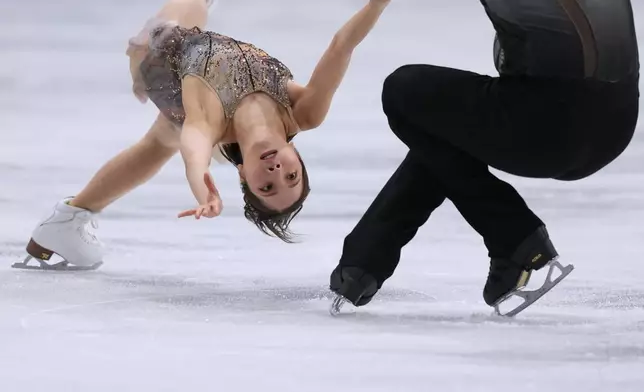 Riku Miura and Ryuichi Kihara of Japan compete during the figure skating pairs team event at the 2026 Winter Olympics, in Milan, Italy, Sunday, Feb. 8, 2026. (AP Photo/Stephanie Scarbrough)
