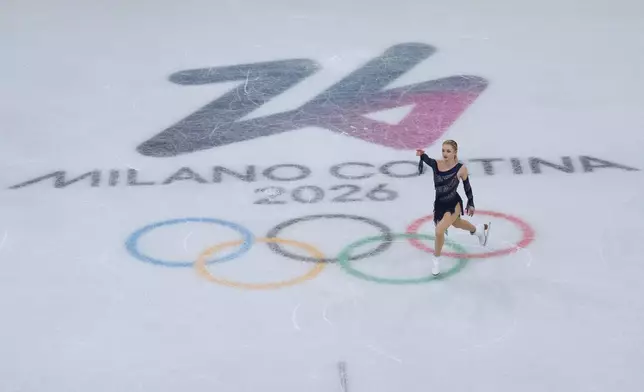 Amber Glenn of the United States competes during the figure skating women's team event at the 2026 Winter Olympics, in Milan, Italy, Sunday, Feb. 8, 2026. (AP Photo/Natacha Pisarenko)