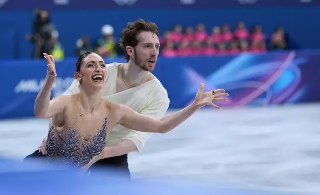 Sara Conti and Niccolo Macii of Italy compete during the figure skating pairs team event at the 2026 Winter Olympics, in Milan, Italy, Sunday, Feb. 8, 2026. (AP Photo/Stephanie Scarbrough)