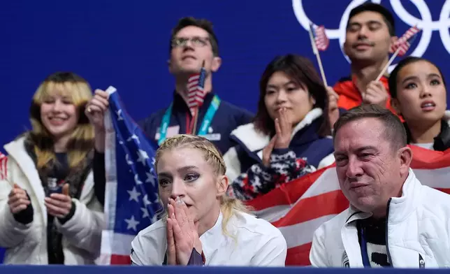 Amber Glenn of the United States reacts to her scores after competing during the figure skating women's team event at the 2026 Winter Olympics, in Milan, Italy, Sunday, Feb. 8, 2026. (AP Photo/Ashley Landis)