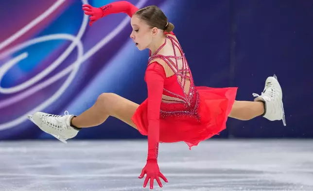 Mariia Seniuk of Israel falls during the women's figure skating free program at the 2026 Winter Olympics, in Milan, Italy, Thursday, Feb. 19, 2026. (AP Photo/Natacha Pisarenko)