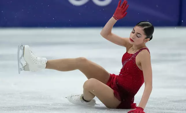 Adeliia Petrosian of Individual Neutral Athletes falls during the women's figure skating free program at the 2026 Winter Olympics, in Milan, Italy, Thursday, Feb. 19, 2026. (AP Photo/Natacha Pisarenko)